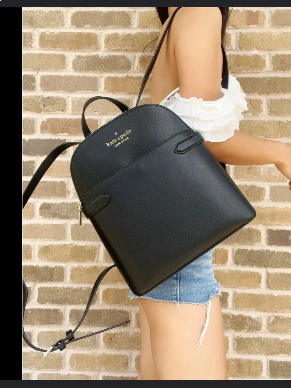 kate spade black leather backpack with gold logo